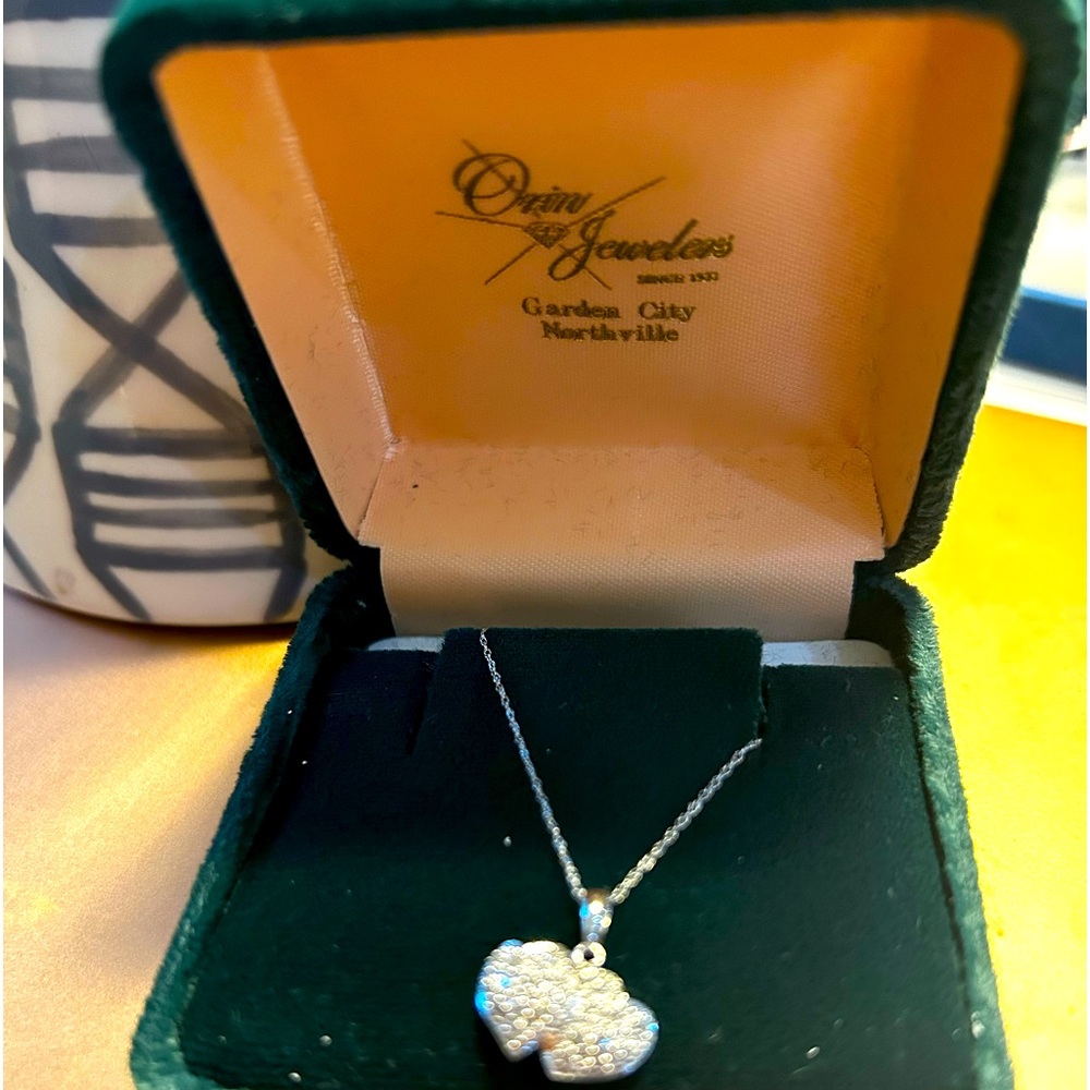 New never warn 10k gold heart pendant with pave diamonds.
